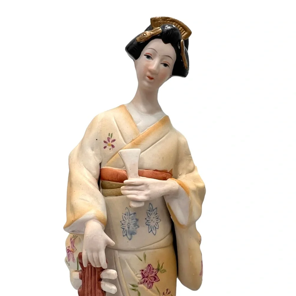 Vintage geisha holding